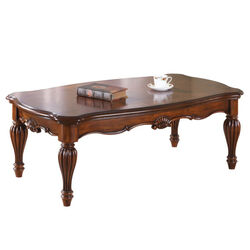 Wooden Coffee Table with Fluted Turned Legs and Carved Design, Brown