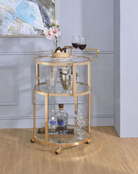 Three Tiered Metal Serving Cart with Glass Inserted Shelves and Curved Side Handle, Gold